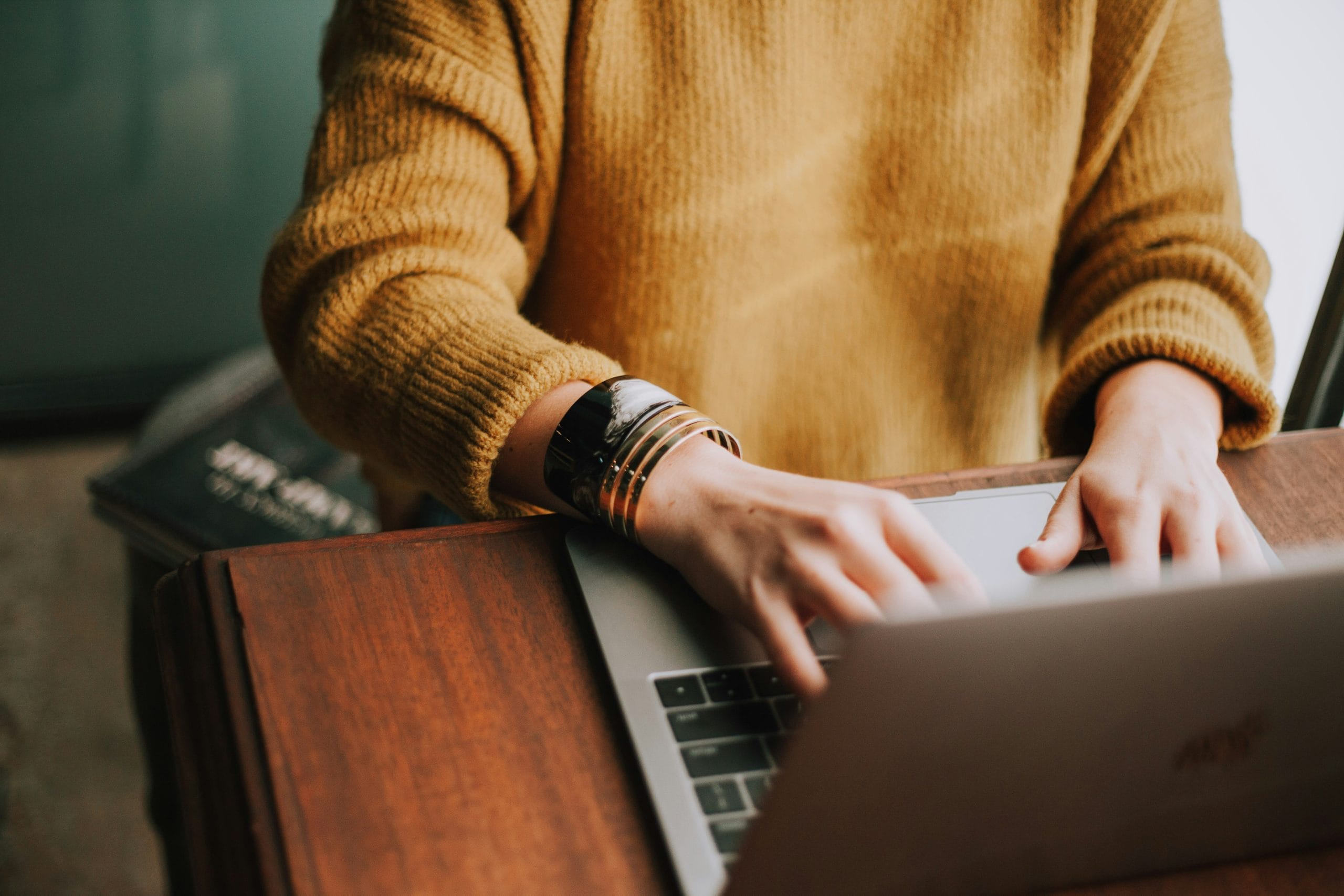 Marketing professional reviewing campaign data on a laptop